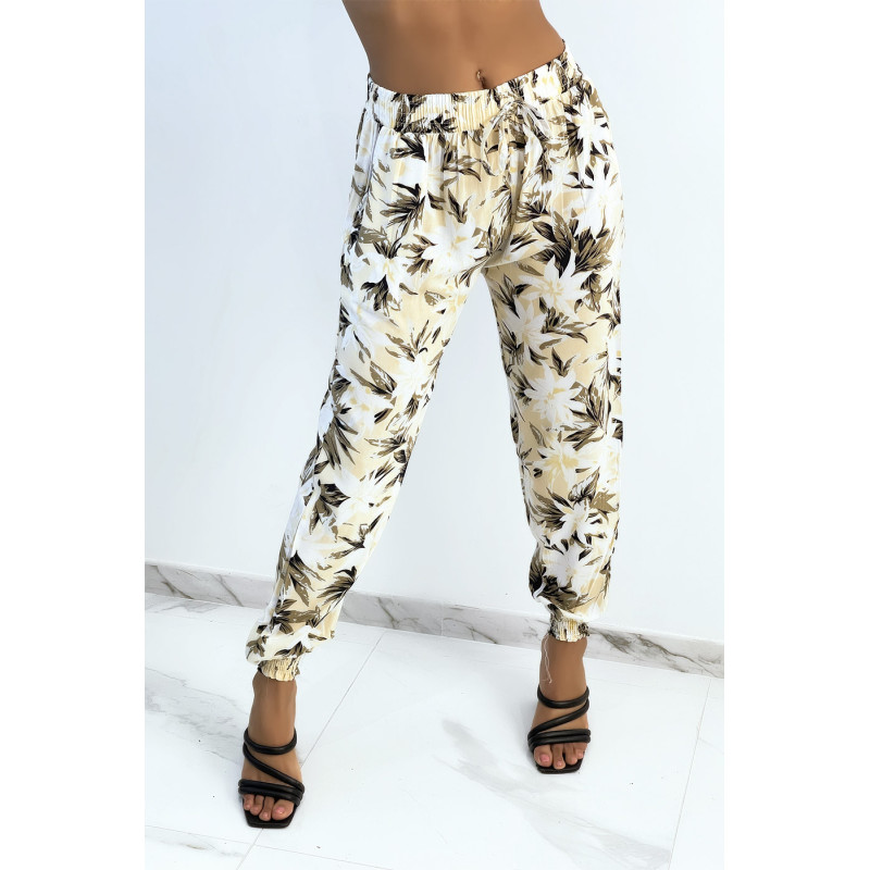 Pantalon fluide beige imprimé tropical resserré aux chevilles