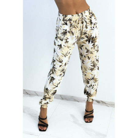 Pantalon fluide beige imprimé tropical resserré aux chevilles