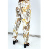 Pantalon fluide beige coupe droite à imprimé plumes multicolors