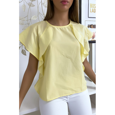 Blouse jaune à volant avec trois boutons à l'épaules