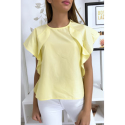 Blouse jaune à volant avec trois boutons à l'épaules