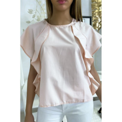 Blouse rose à volant avec trois boutons à l'épaules