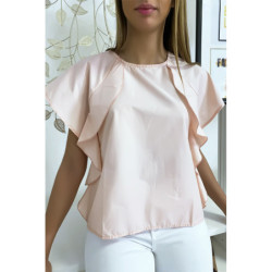 Blouse rose à volant avec trois boutons à l'épaules