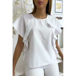 Blouse blanche à volant avec trois boutons à l'épaules