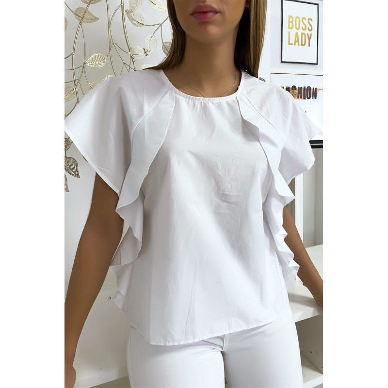 Blouse blanche à volant avec trois boutons à l'épaules