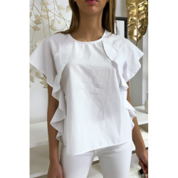 Blouse blanche à volant avec trois boutons à l'épaules